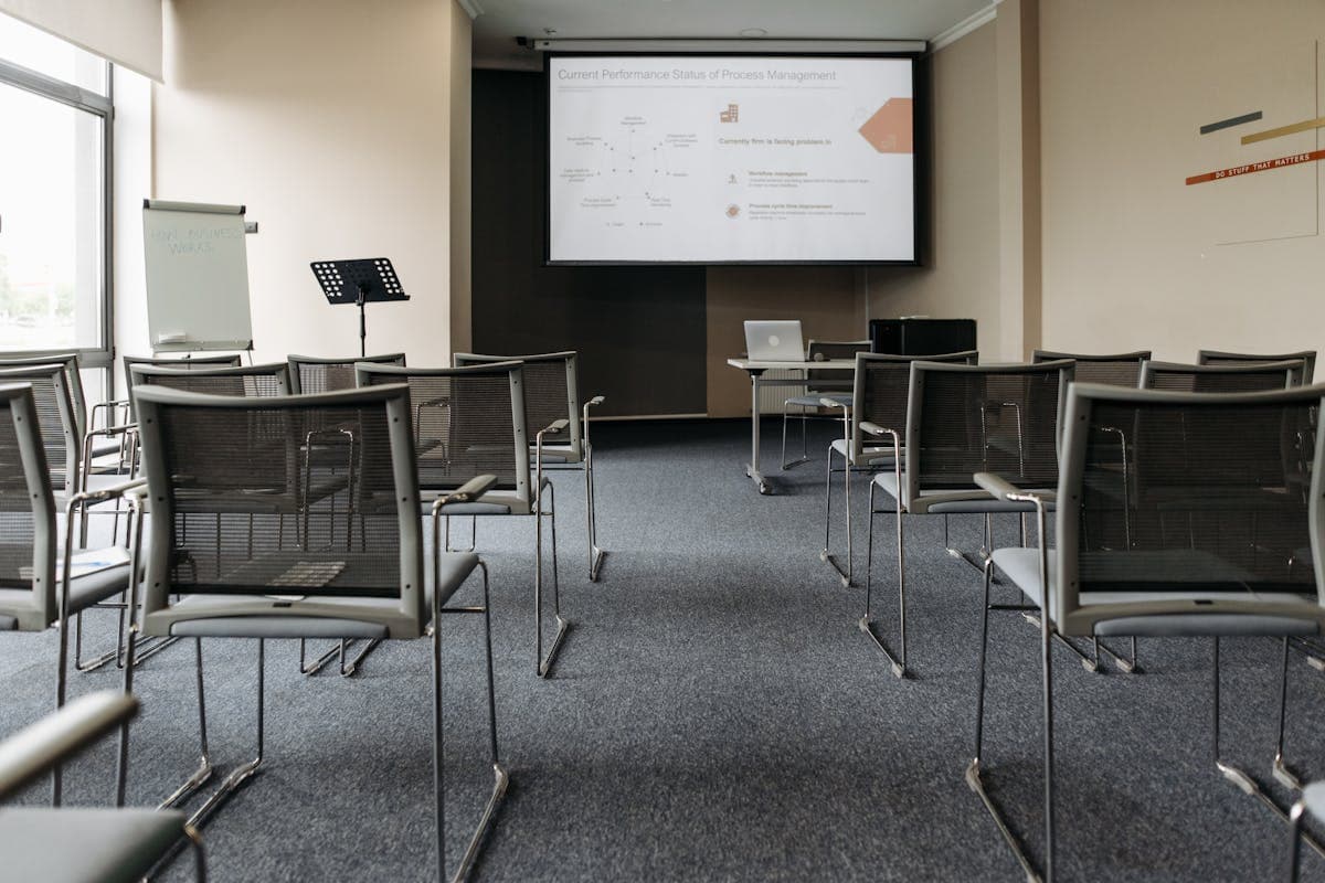 Professional training room with presentation screen and seating